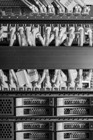 network cables connected to switch - closeup of data center hardwareの写真素材