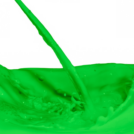 green paint splashing on whiteの写真素材