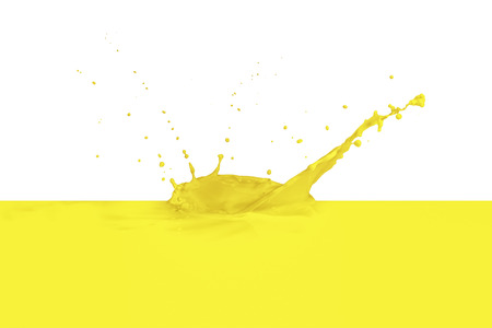yellow paint splashing isolated on whiteの写真素材