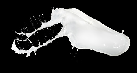 milk splash isolated on black backgroundの写真素材