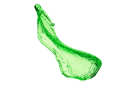 green juice splash on white backgroundの写真素材