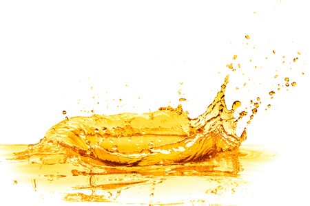 orange juice splash isolated on white backgroundの写真素材