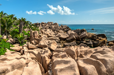 tropical turquoise sea with granite bouldersの写真素材