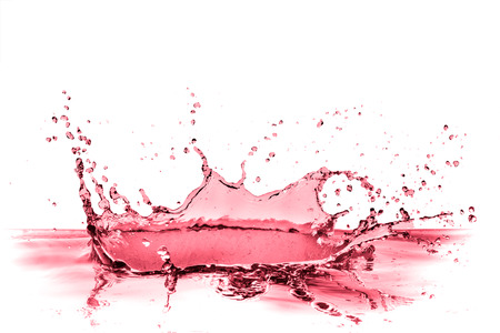 red wine splash isolated on whiteの写真素材