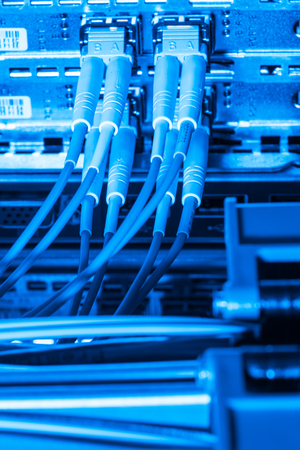 network cables connected to switch - closeup of data center hardwareの写真素材