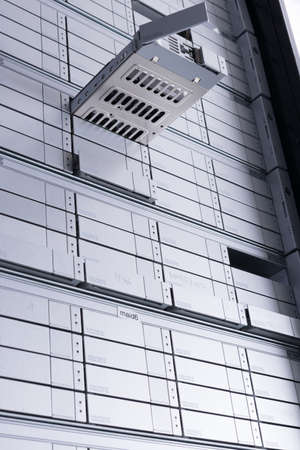 hard drive repair concept - hard disk inside tray is pulled out of internet cloud data storage array