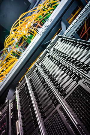 Row of hard disks used for data storage in internet data centerの写真素材