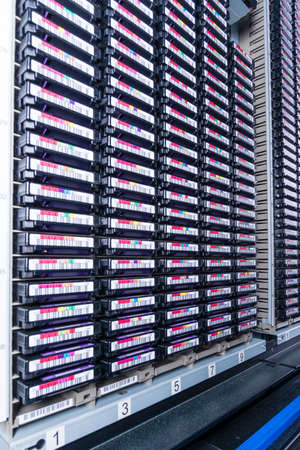 tall stacks of data backup tapes in internet cloud center