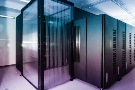 server room with row of data storage cabinetsの写真素材