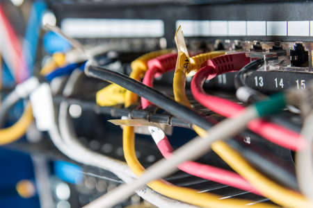 Detail of server with patch cables plugged in portsの写真素材