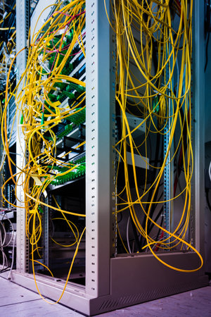 data center with bundle of fiber optics cables connected to data switch