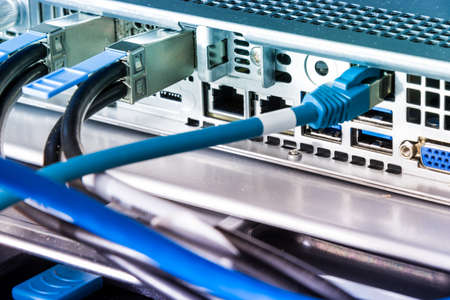 backside of server rack with patch cable connected into the switch panel