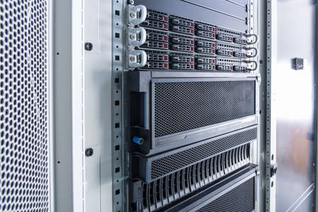 Row of hard drives serving as data storage inside server room