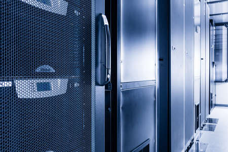 data center with row of data storage cabinetsの写真素材