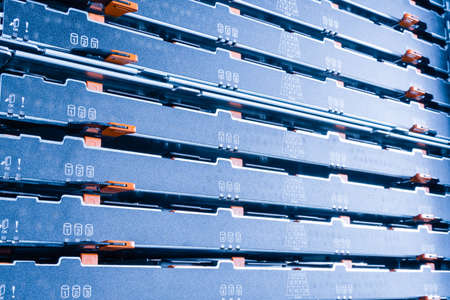 detail of data storage hardware inside data center - cluster of hard drives inside server rack