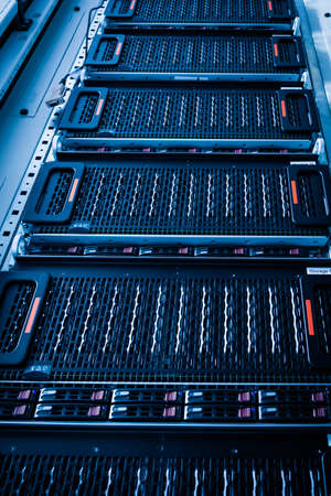 Row of hard drives serving as data storage inside server room