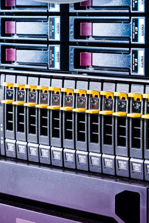 Row of hard drives serving as data storage inside server room