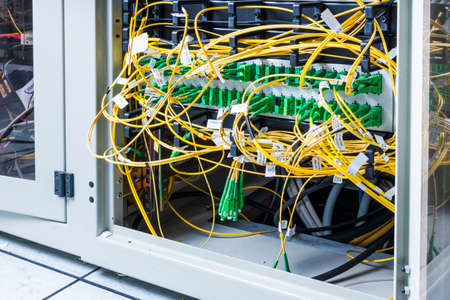 server inside data center with  cables connected to data switchの写真素材