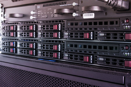 Row of hard drives serving as data storage inside server roomの写真素材