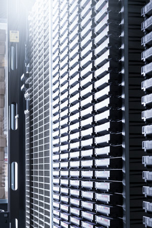 cluster of hard drives stacked inside data storage cabinet
