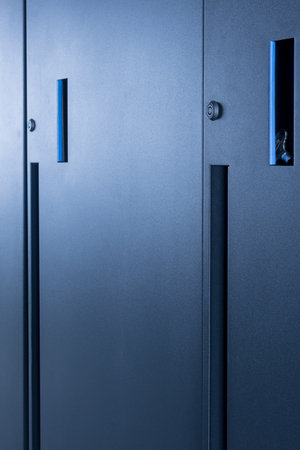 row of server cabinets with detail on door lock as internet security abstractの写真素材