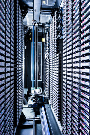 rows of data cloud hardware inside data centerの写真素材