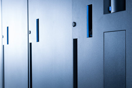row of server cabinets with detail on door lock as internet security abstractの写真素材