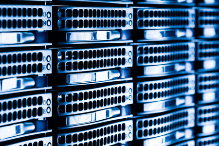 Row of hard drives serving as data storage inside server roomの写真素材