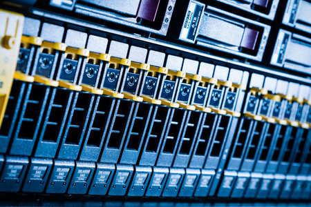 Row of hard drives serving as data storage inside server roomの写真素材