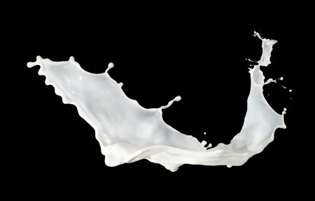 milk splash isolated on black backgroundの写真素材