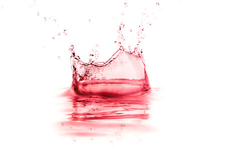 red wine splash isolated on white backgroundの写真素材
