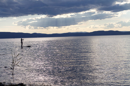 Paddleboarder at Sunsetの写真素材