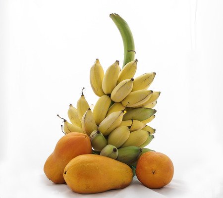 Beautiful colors of bananas and papaya の写真素材