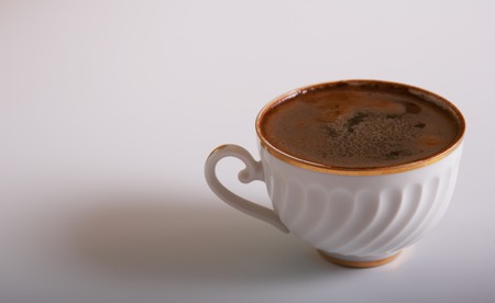 Cup of black coffee against white backgroundの写真素材