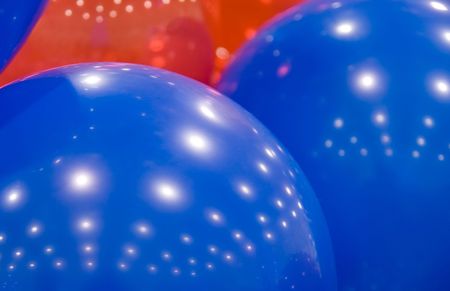 Close-up view of several blue and red balloonsの写真素材