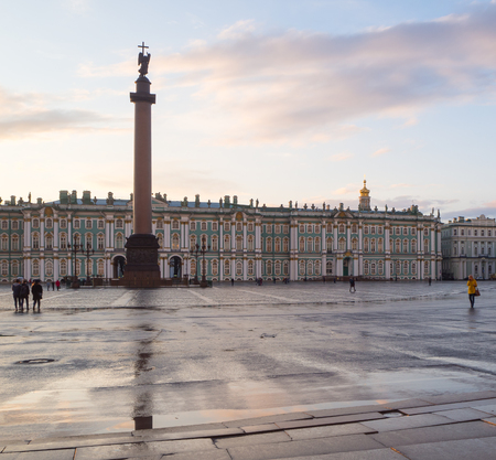 Hermitage and palace square in the evening, wet asphalt with reflections and cloudy skyのeditorial素材