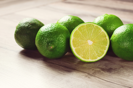 ripe lime on a wooden tableの写真素材
