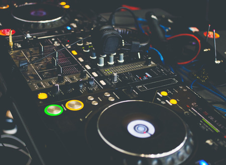 Close up DJ console with DJ headphones.の写真素材