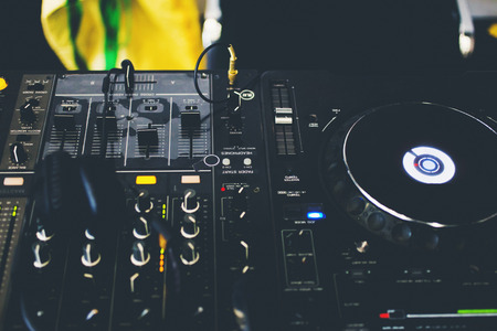 Close up DJ console with DJ headphones.