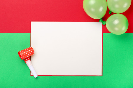 Close up blank card with holiday items on colorful background. Colorful celebration background. Flat layの写真素材