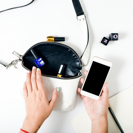 Flat lay hands of a woman with beautiful summer manicure on white background, top viewの写真素材