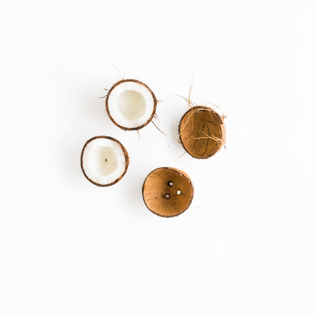 Creative layout made of coconuts and leaves. Flat lay. Top view. Summer backgroundの写真素材