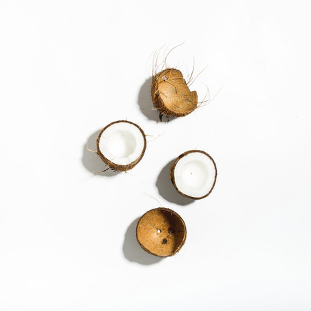 Tropical pattern of coconut on white background. Top view. Flat lay. Summer backgroundの写真素材