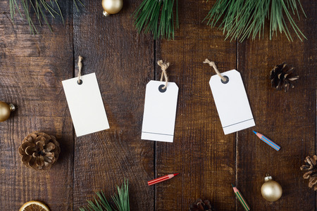 Price tag and Christmas decorations on dark wooden table, top view. Christmas backgroundの写真素材