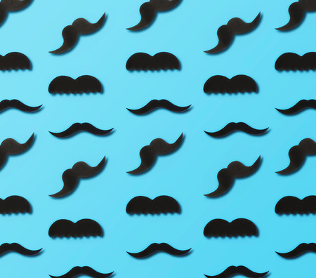 Father's Day concept. Paper mustache on a blue background, top viewの写真素材
