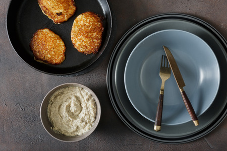 Top view potato pancakes with mushroom sauce on dark backgroundの写真素材