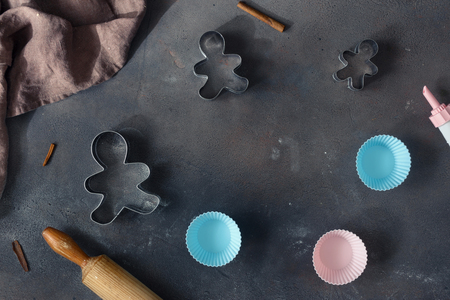 Bakery background. Frame of bakeware and rolling pin on dark background top viewの写真素材
