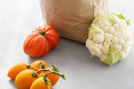 Paper bag with healthy food on gray backgroundの写真素材