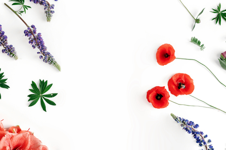 Pattern flowers wildflowers, poppy, amaryllis, peonies on white background. Flat lay, top view. Pattern of flowers with copy spaceの写真素材
