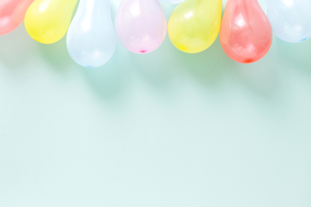 Set different colorful balloons. Pattern decoration party concept on pastel blue background flat lay top viewの写真素材